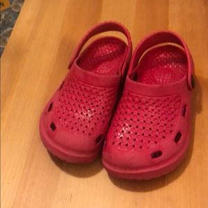 Pink crocs-like shoes